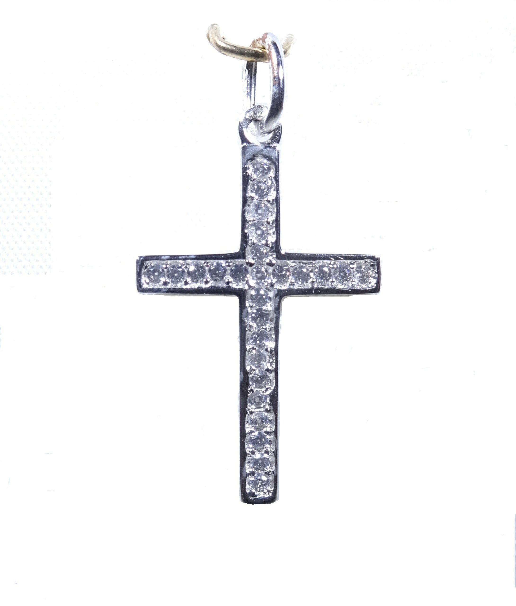 Cruz de circonitas en oro blanco de 18K